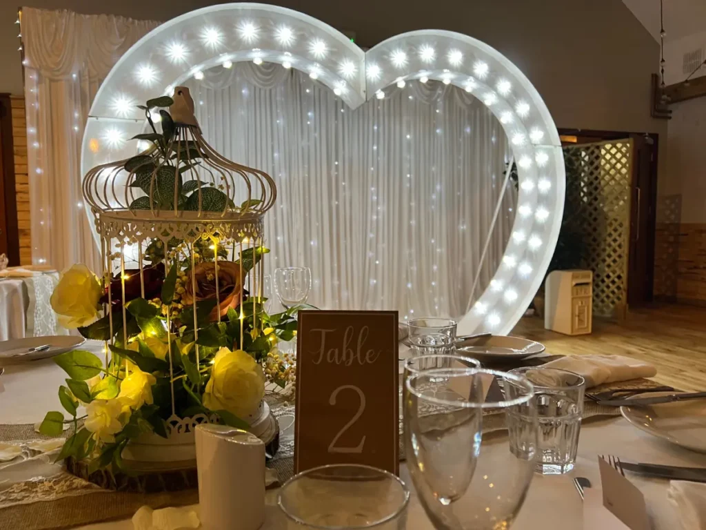 wedding decor hire from mjs entertainment featuring our tablewear birdcage centrepieces and lightup heart arch